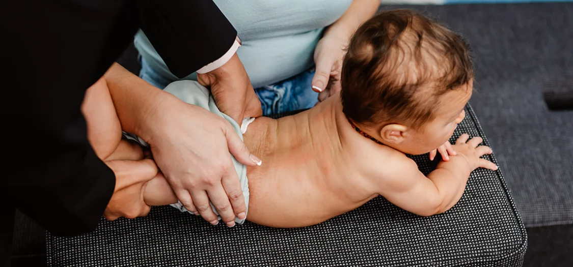 baby getting a chiropractic adjustment